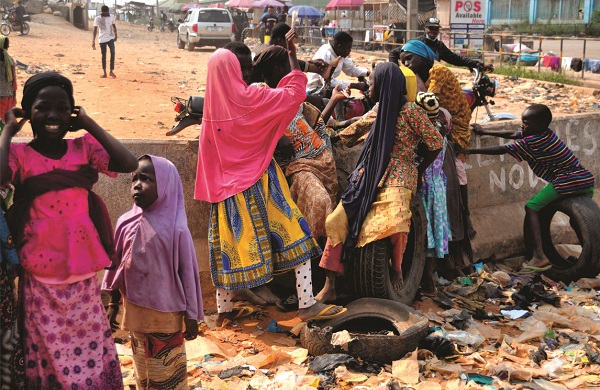 Group of children sitting on a roadside in Kebbi instead of attending school