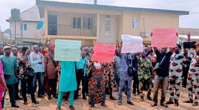 Angry investors protest outside CBEX office in Lagos, Nigeria, after losing millions.