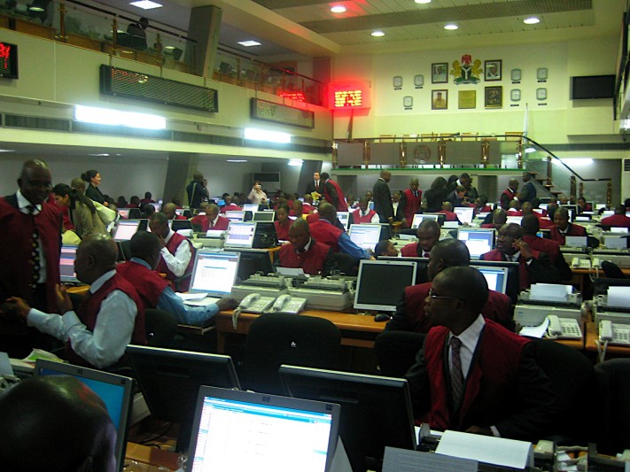 Nigerian journalists reporting in a busy newsroom