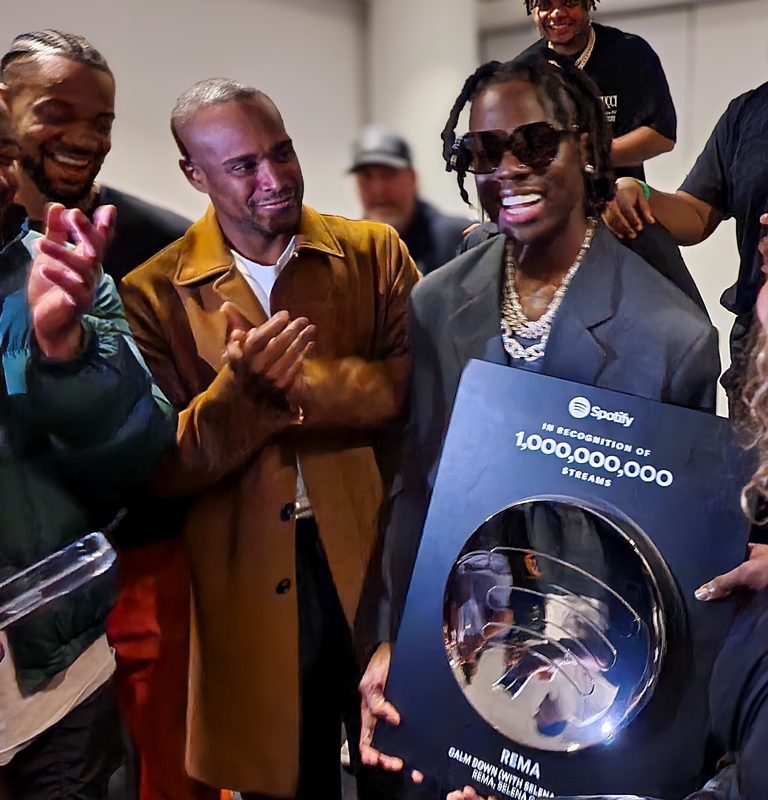 Rema performing on stage, celebrating his historic 5 billion Spotify streams, a milestone for Afrobeats.